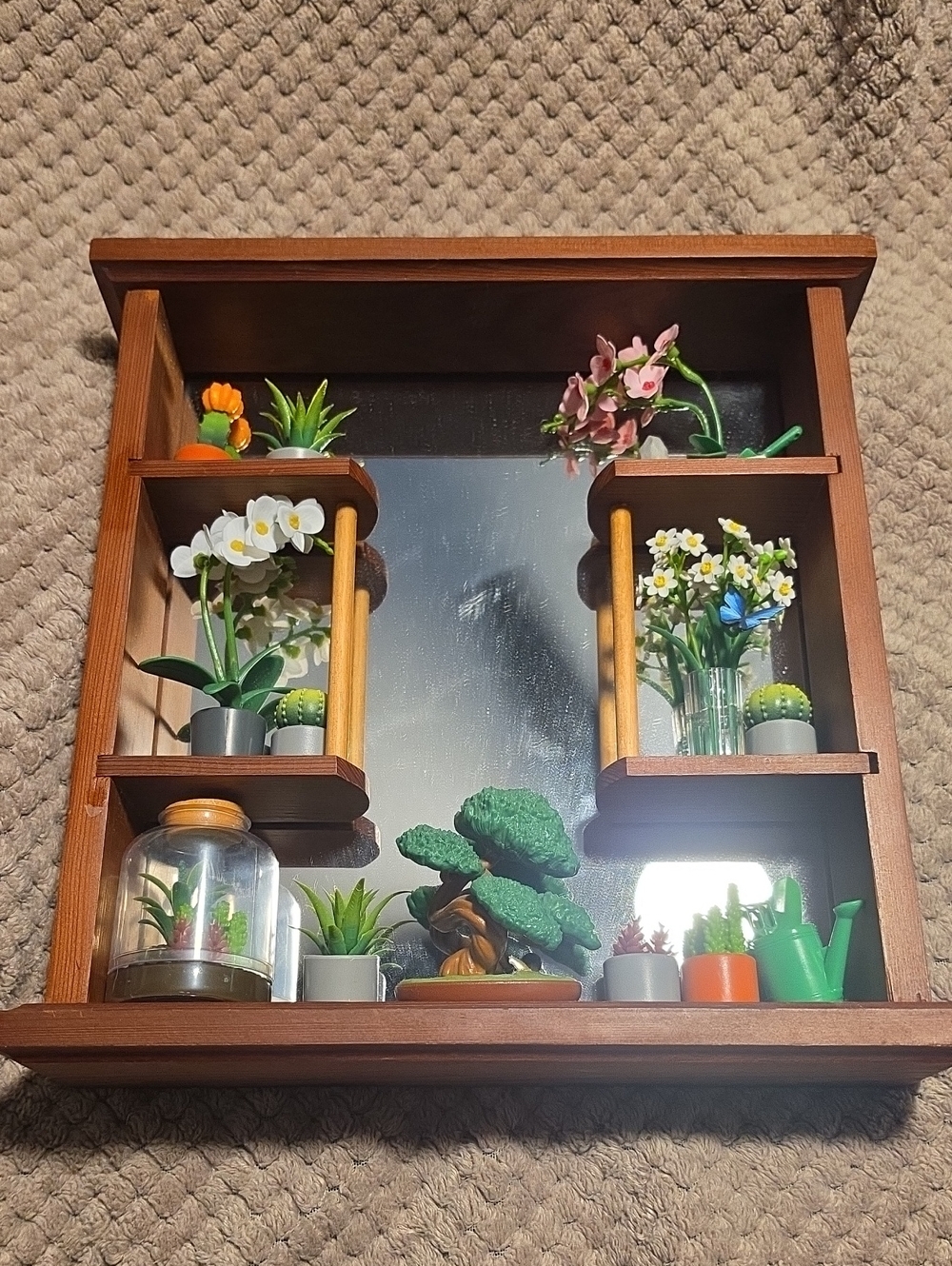 Wooden Mirrored Wall Shelf with Decorative Green and Brown Accents